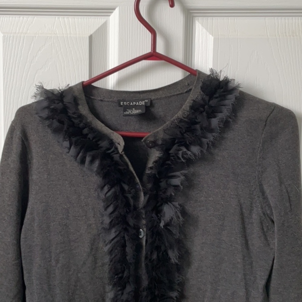 Escapade cardigan with ruffled raw edge.